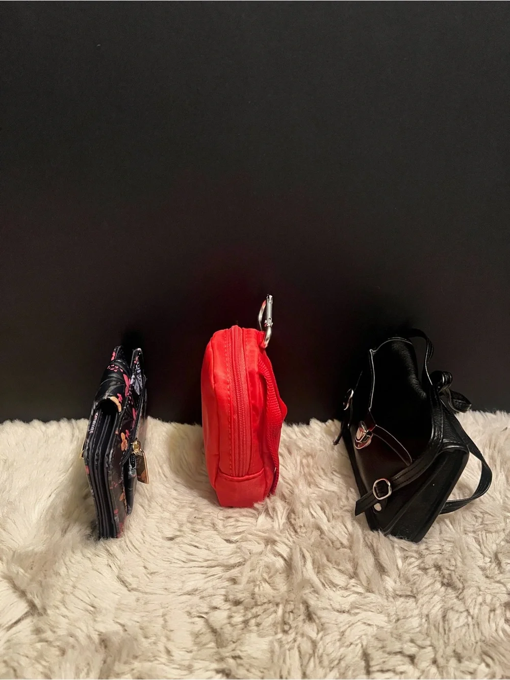 Three piece bundle of two coin, purses, and one small wallet